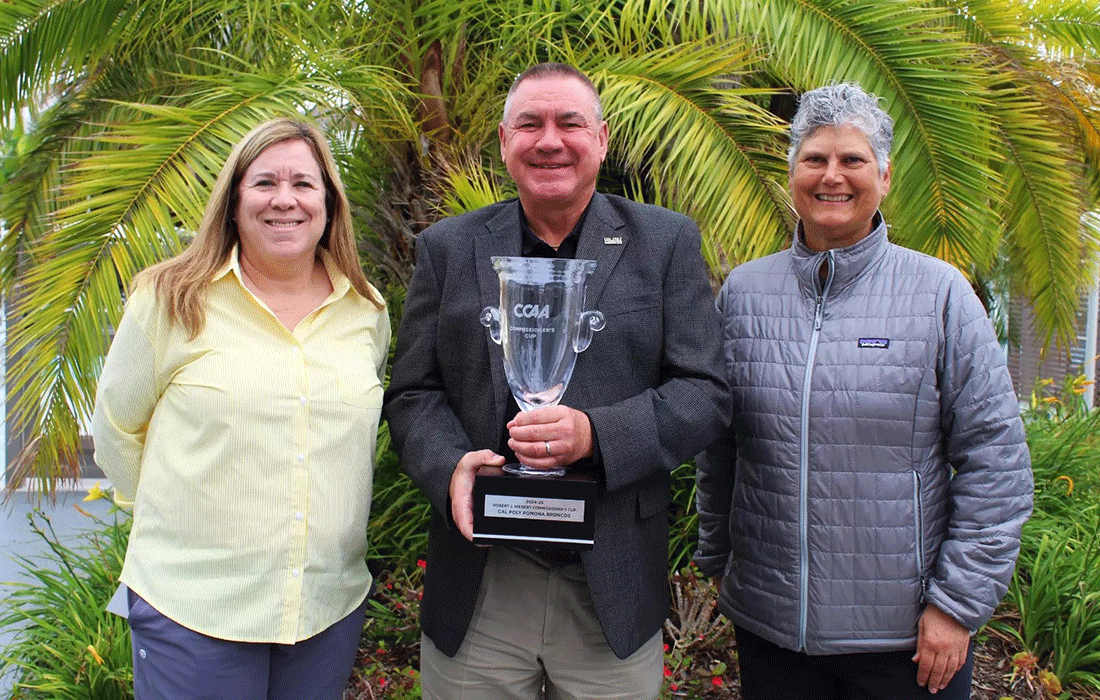 Coaches of the Year winners Traci Dahl, Chris Breadford and Danelle Bishop hold the Commissioners Cup