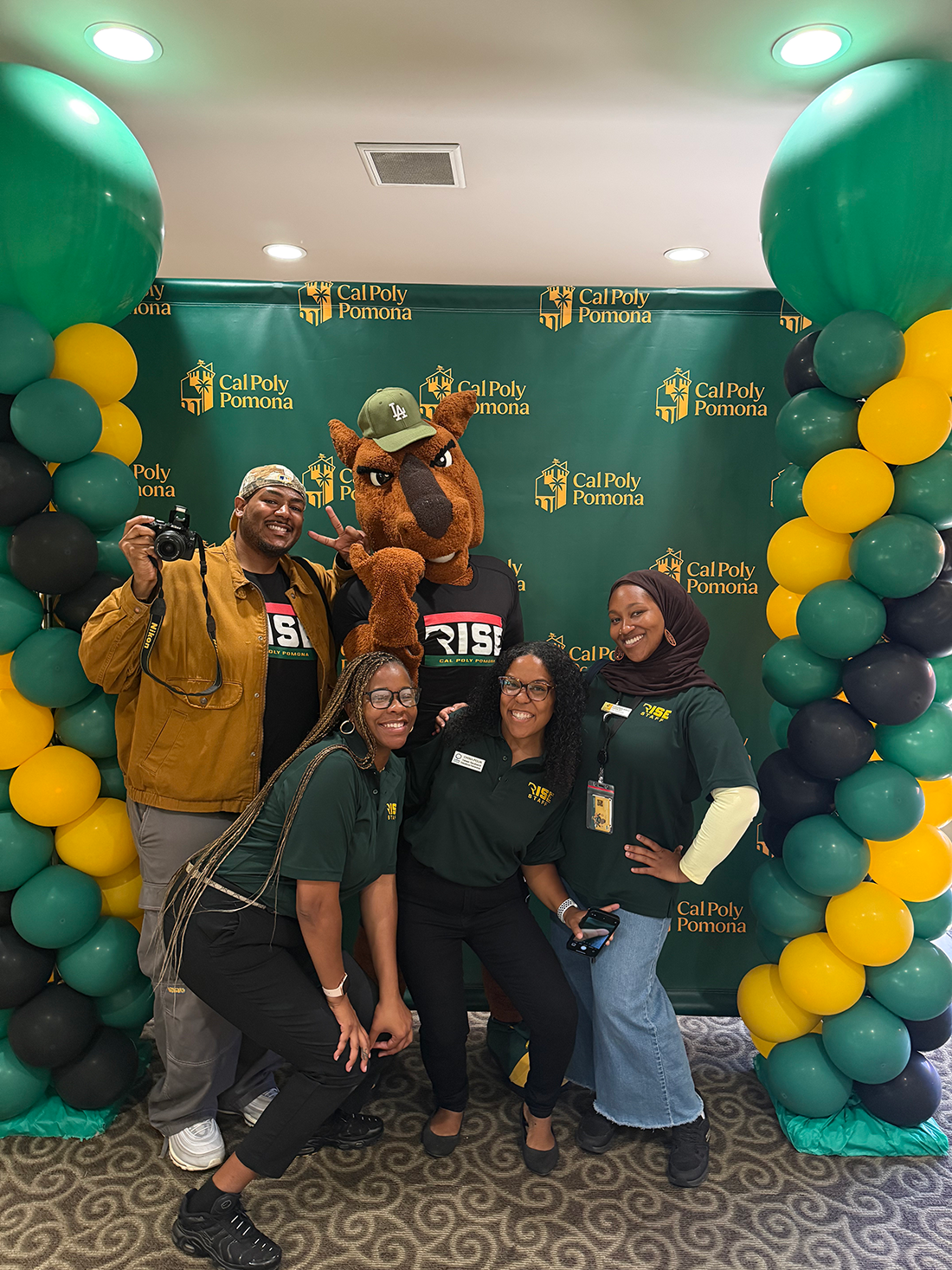 RISE Summer Staff pose with Billy Bronco