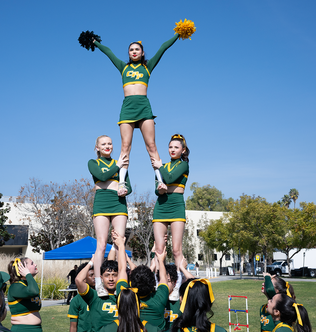 CPP Cheer team performs during the 2025 Green and Gold block party.