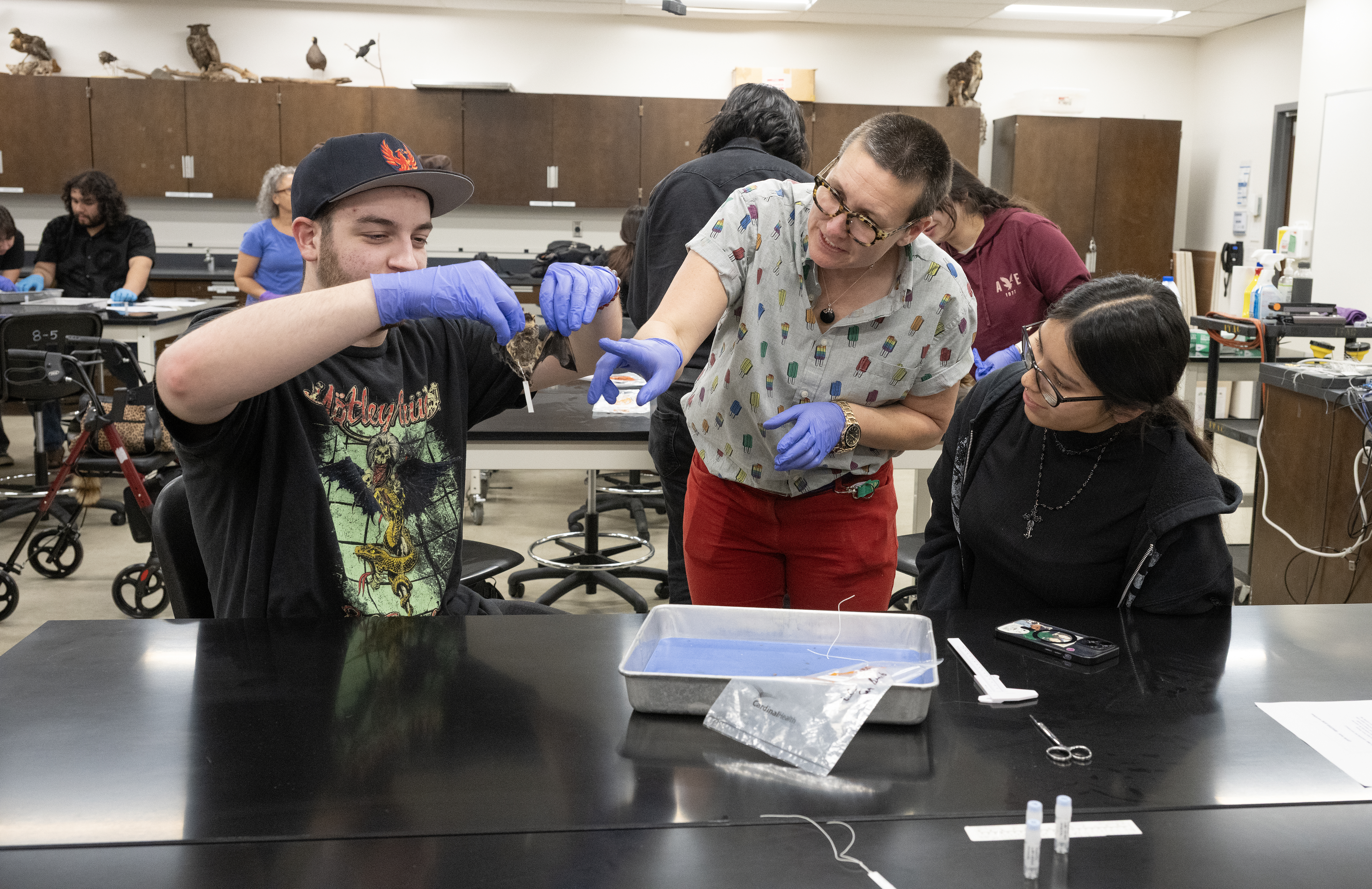 Professor Blakey works with two students in Bat Club.