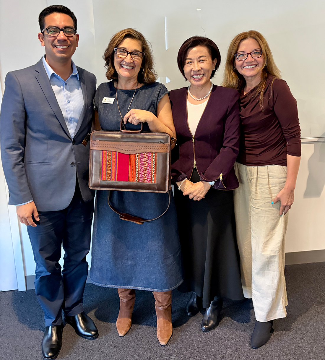 Provost Gomez holds a Peruvian bag 