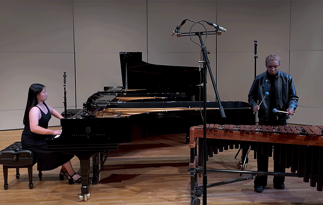 two members on the piano ensemble perform at Carnegie Hall.
