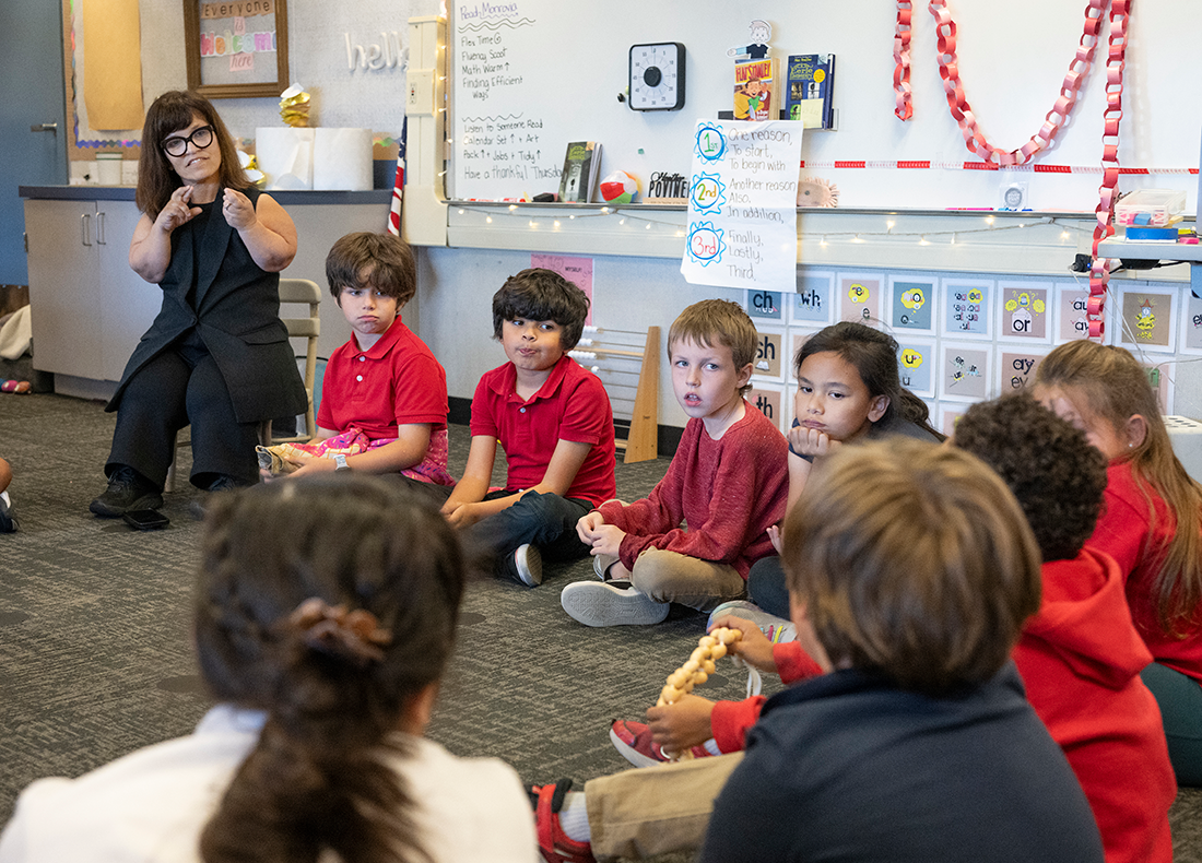 Heather Povinelli speaks to children in her classroom. 