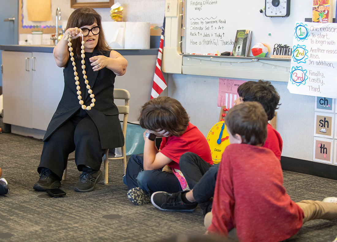 Heather Povenelli uses beads during math instruction.
