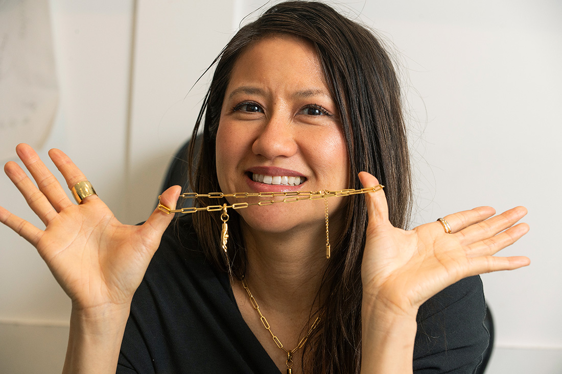 Sonia Hou holds one of her designer necklaces.