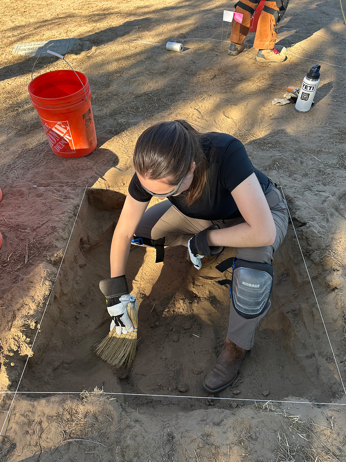 Amelia Bellah digging at the field school.