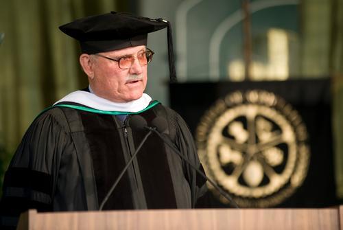 Don B. Huntley walking during Commencement