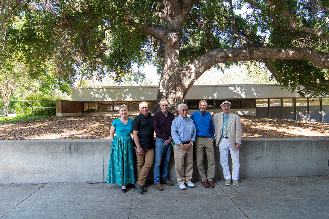 Jere French pictured right stands with a group of colleagues during an event. 