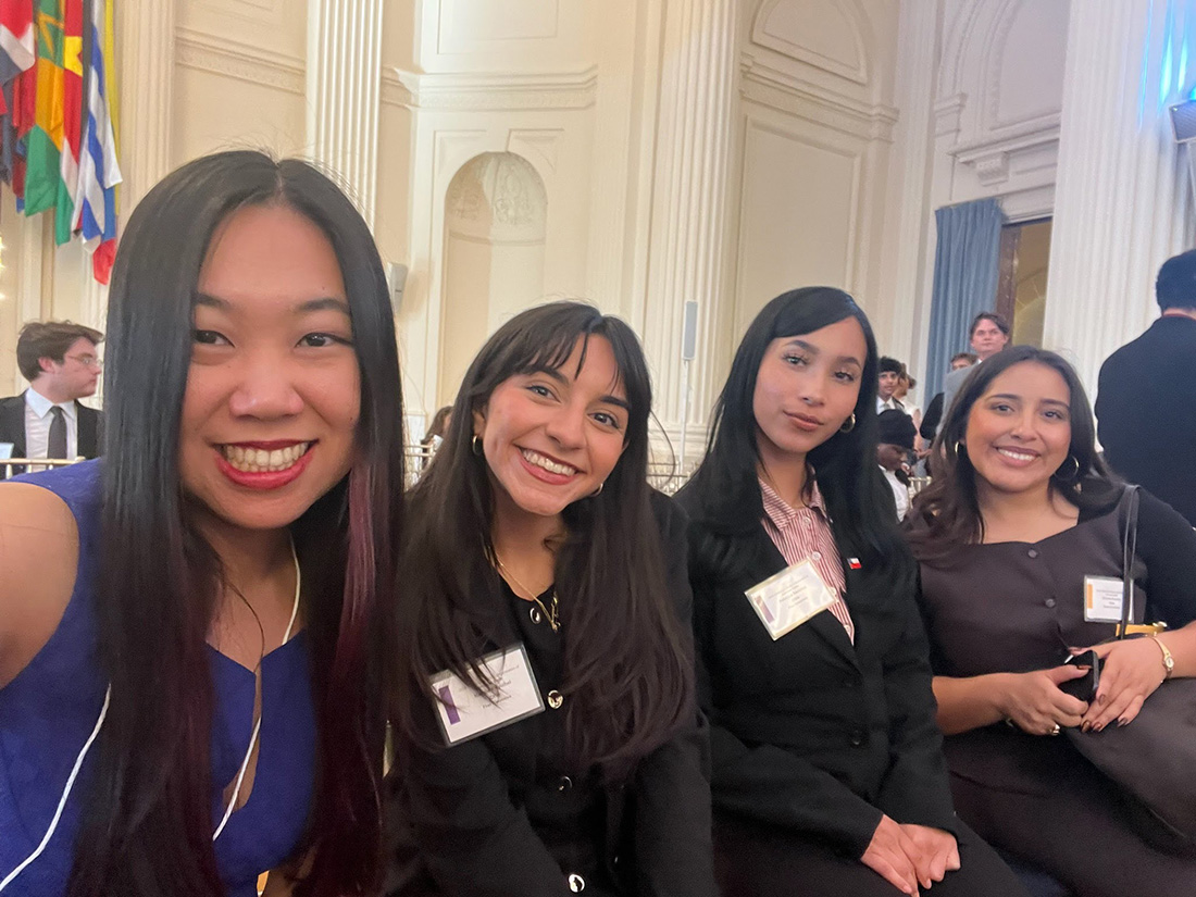Mary Anne Mendoza with three female students during Model OAS 2026 opening.