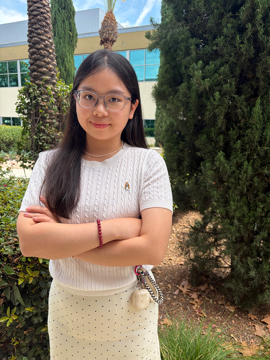 Zhoy Ziyyu poses with her arms crossed.
