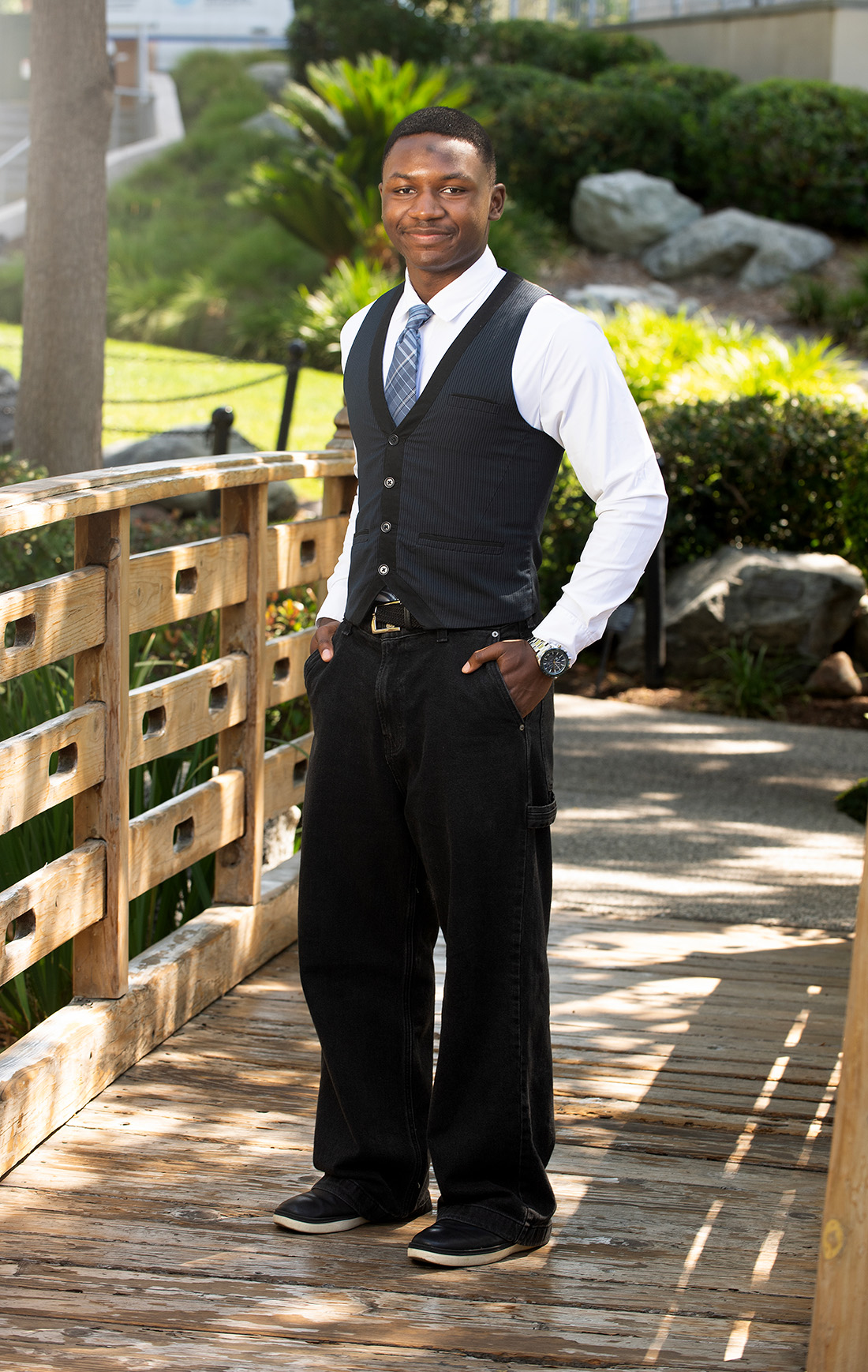 KeJuan Jones poses on the bridge of the Japanese garden. 