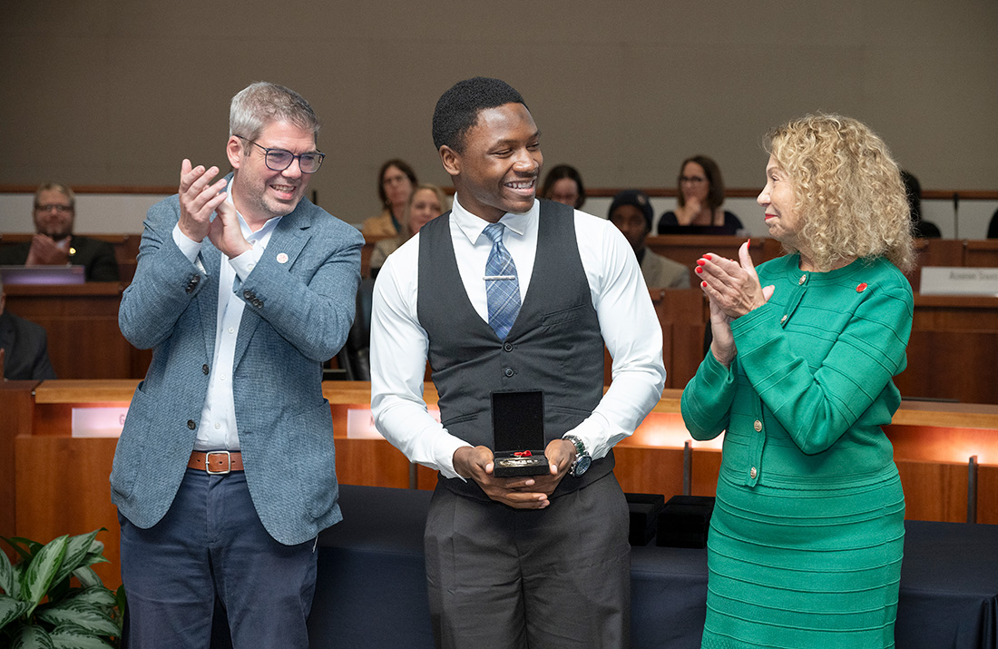 KeJuan Jones with CSU Chancellor Mildred Garcia and another member of the board of trustees