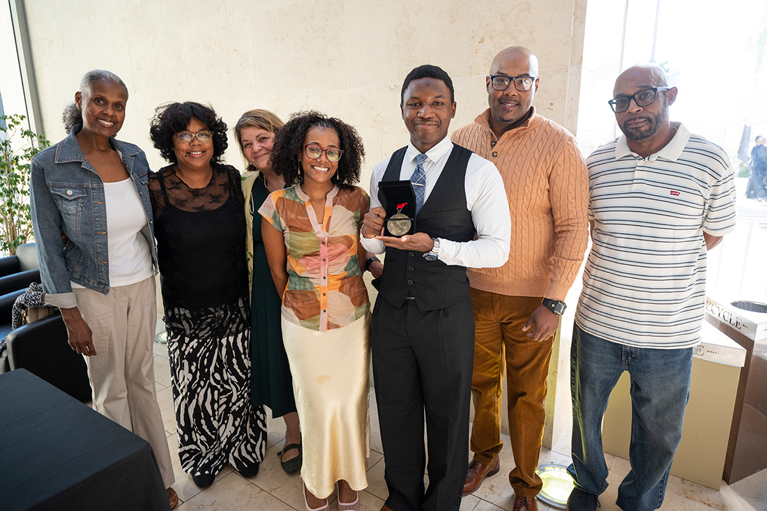 KeJuan Jones with CPP President Vanya Quinones, and family and friends.