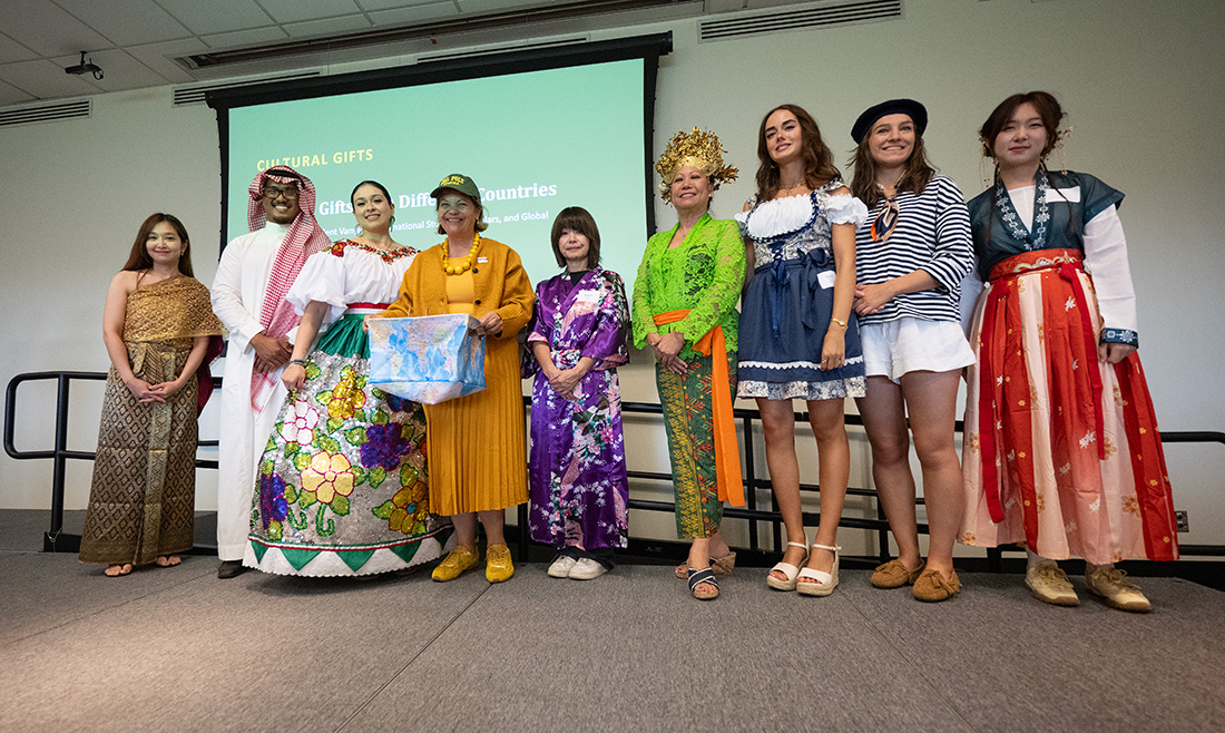 President Vanya's stands with students during opening remarks for International Week.