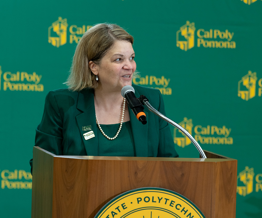 President Vanya speaks to the campus community from a podium in Kellogg Gym.