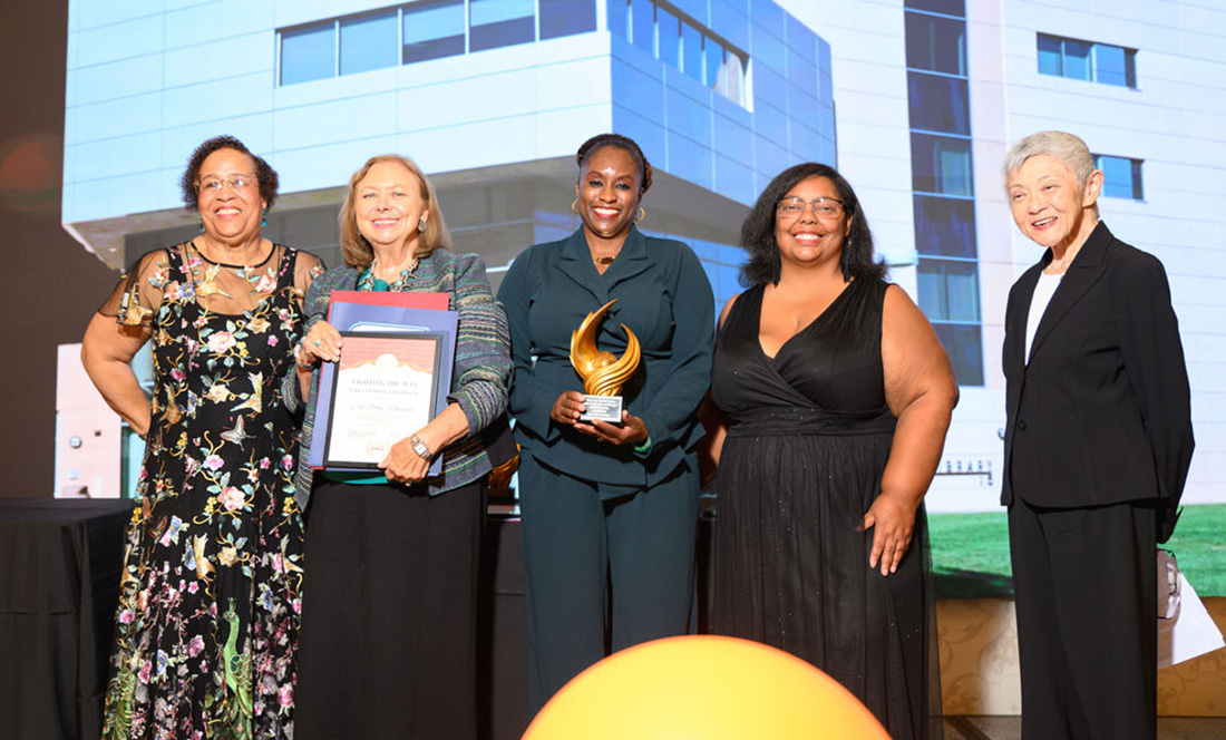 Dean Jenelle Pitt-Parker and Faculty members accept the award at the Champions of Change Award Ceremony.