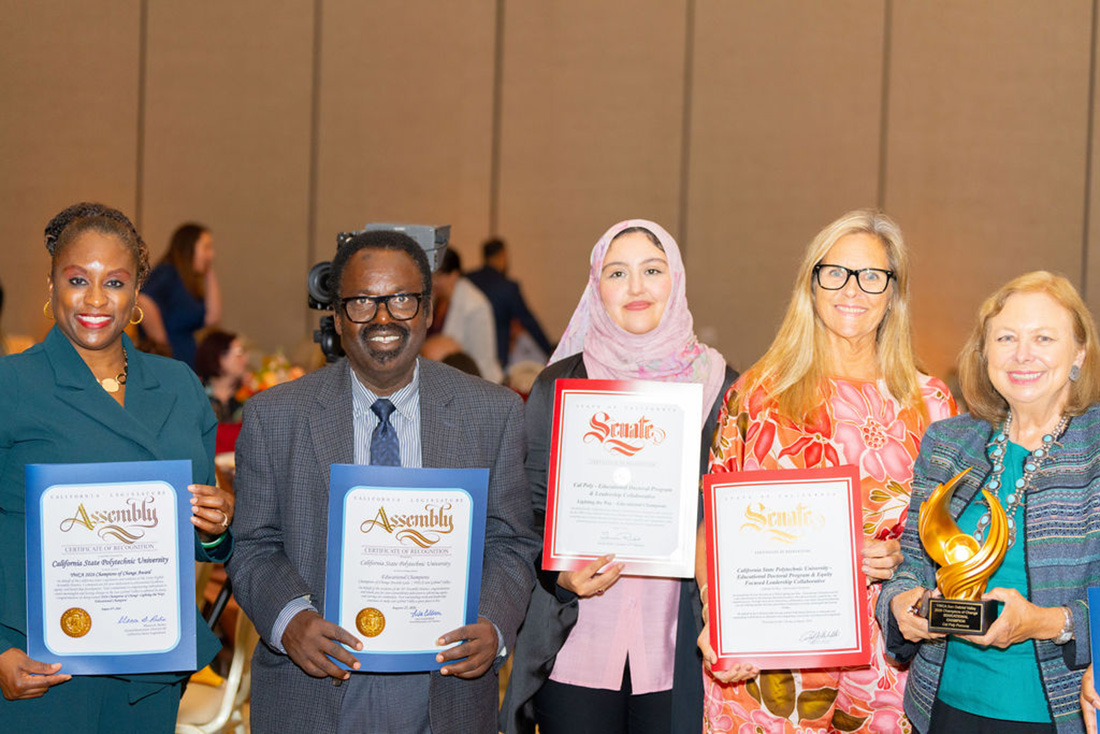  Dean Jenelle Pitt-Parker and other members from CEIS hold award certificates.