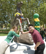 Amanda Smith and Chris Chen pat the Bronco statue's hoof following its unveiling on May 26, 2010.