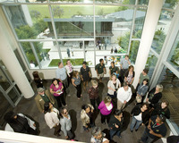 Visitors take a tour of a common room in the Residential Suites Phase II on May 26, 2010.