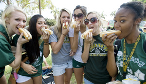 The volleyball team enjoys hot dogs at the 2009 Hot Dog Caper.