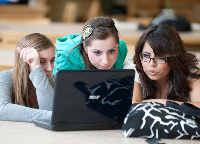Hilary Tavolazzi, Haikouhi Avetisyan and Alexandria Escobedo work together on a California history paper in the University Library March 17, 2011.