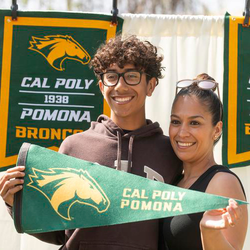 students holding a Cal Poly Pomona pennant