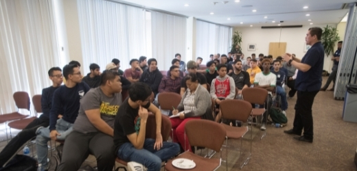 Students listen to a speaker during a conference