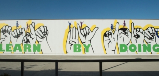 Learn by Doing mural displayed in sign language 