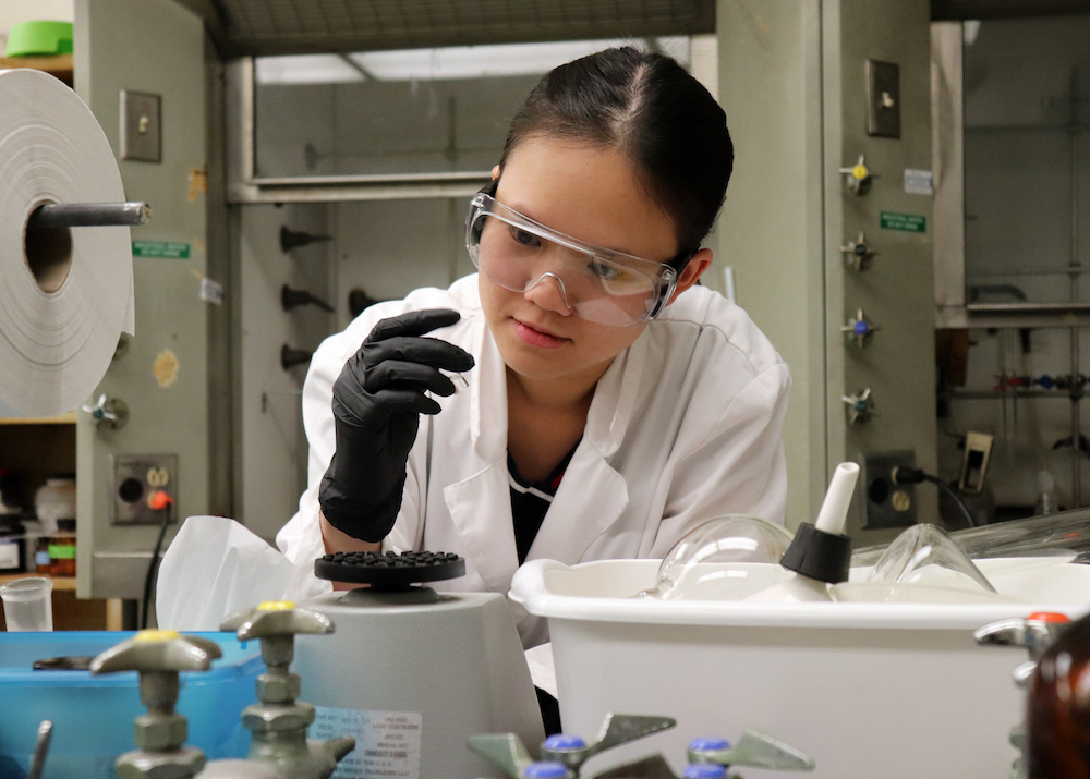 Image of Nhan in a lab setting