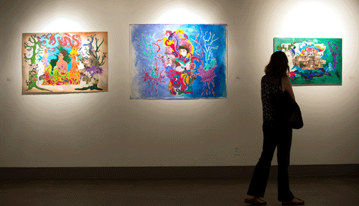 Guest walking through the Poly Kroma art gallery.