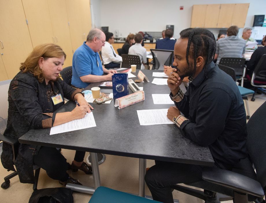 A student getting help on his resume.
