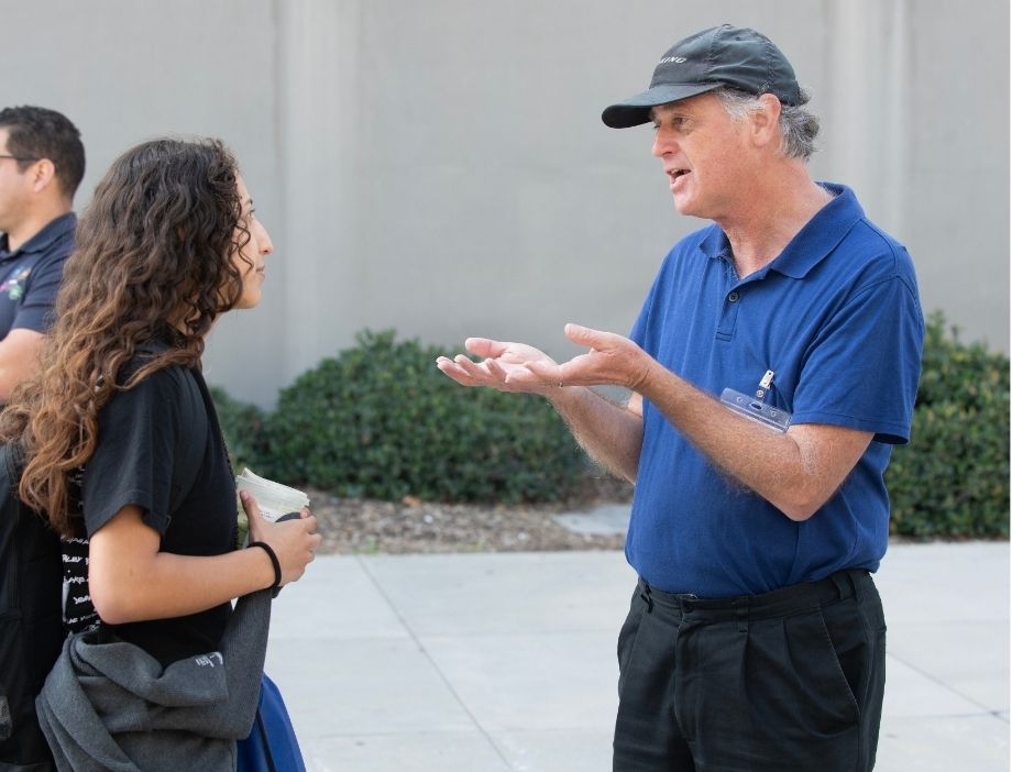 A faculty member communicating with a student.