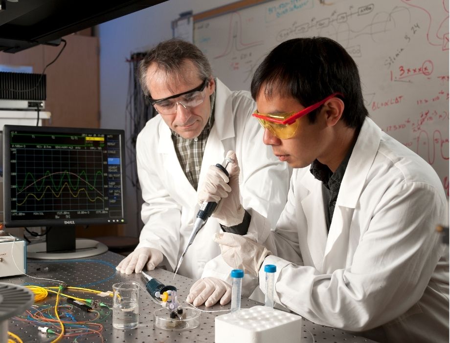 Faculty working with a student in the lab.