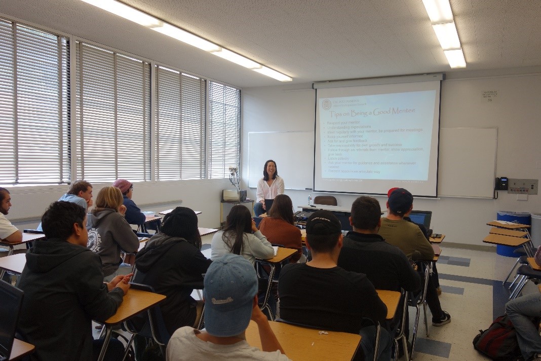 Winny Dong presenting a workshop to students.