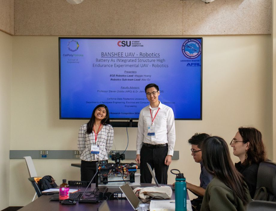 Two students presenting their research at the CSU competition.