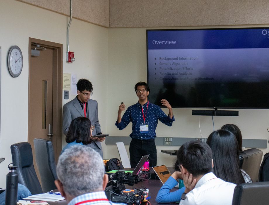 Two students presenting their research.