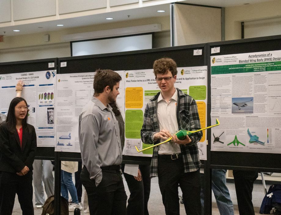 A student demonstrating his research project.