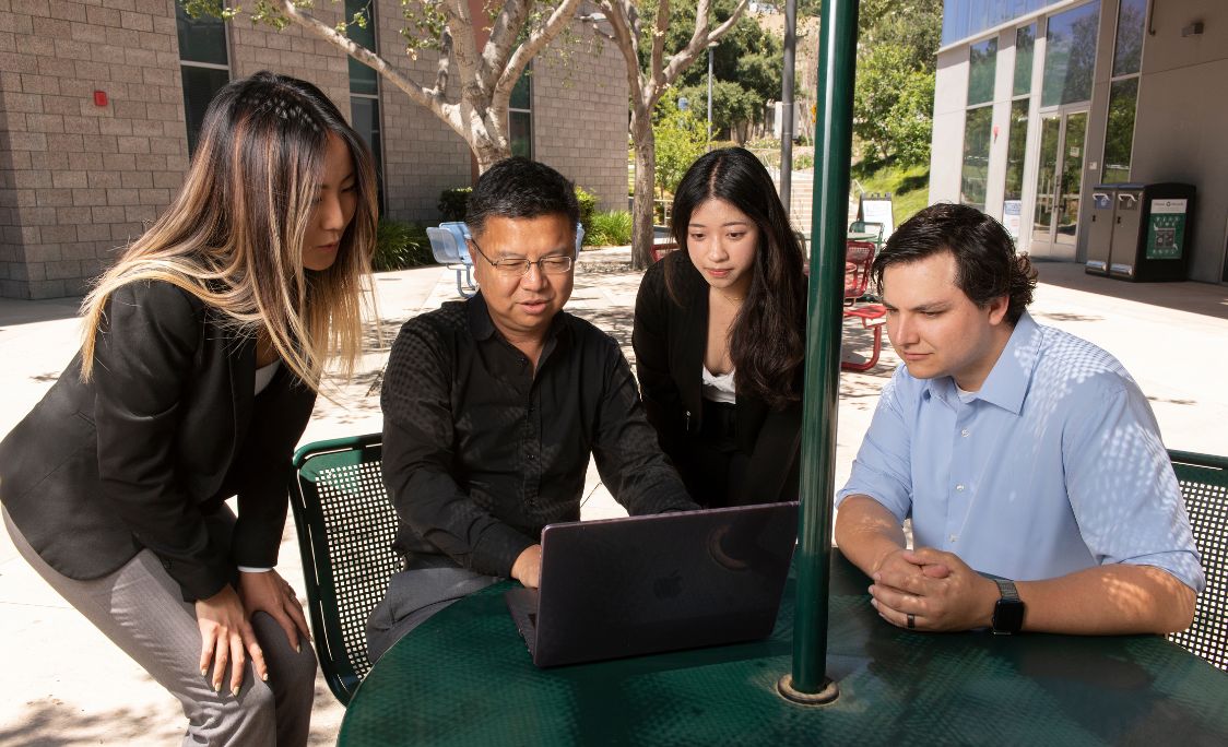 A faculty member speaking to students.