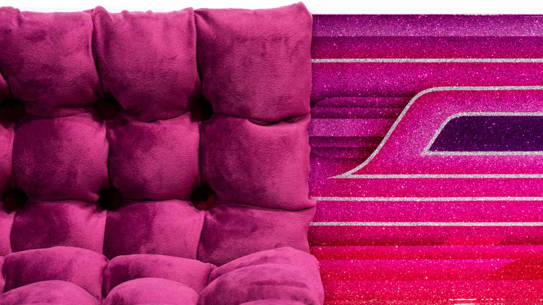 Dark Pink deep button tufting cushion, next to a multiline textile with different pink accents