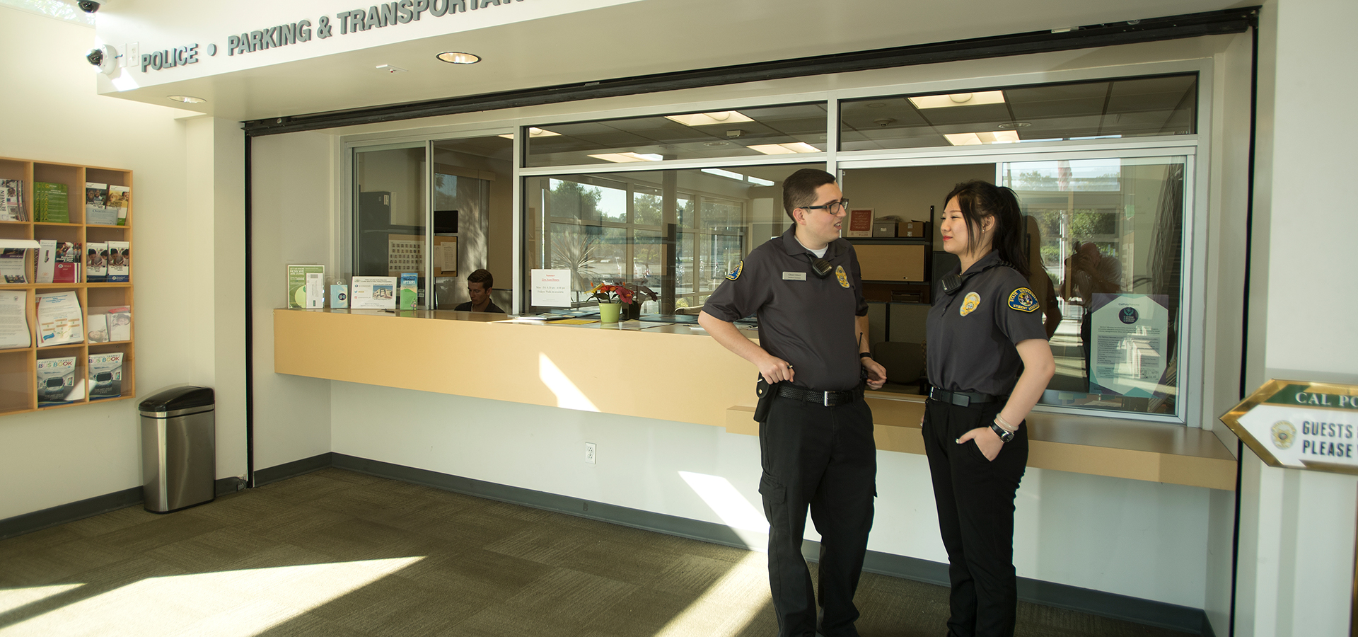 Student Assistants in front of the window in the UPD office