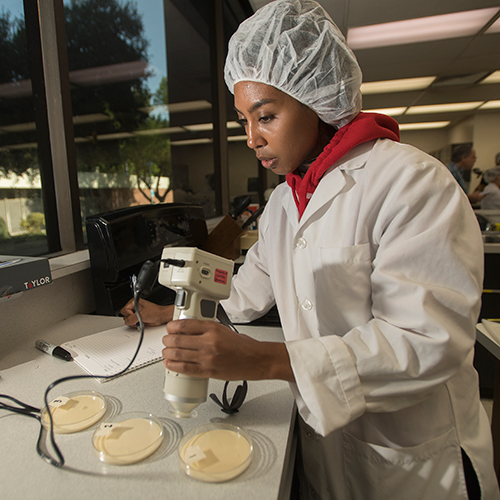 Melissa Hearvy checks the color of batter at Nutrion class