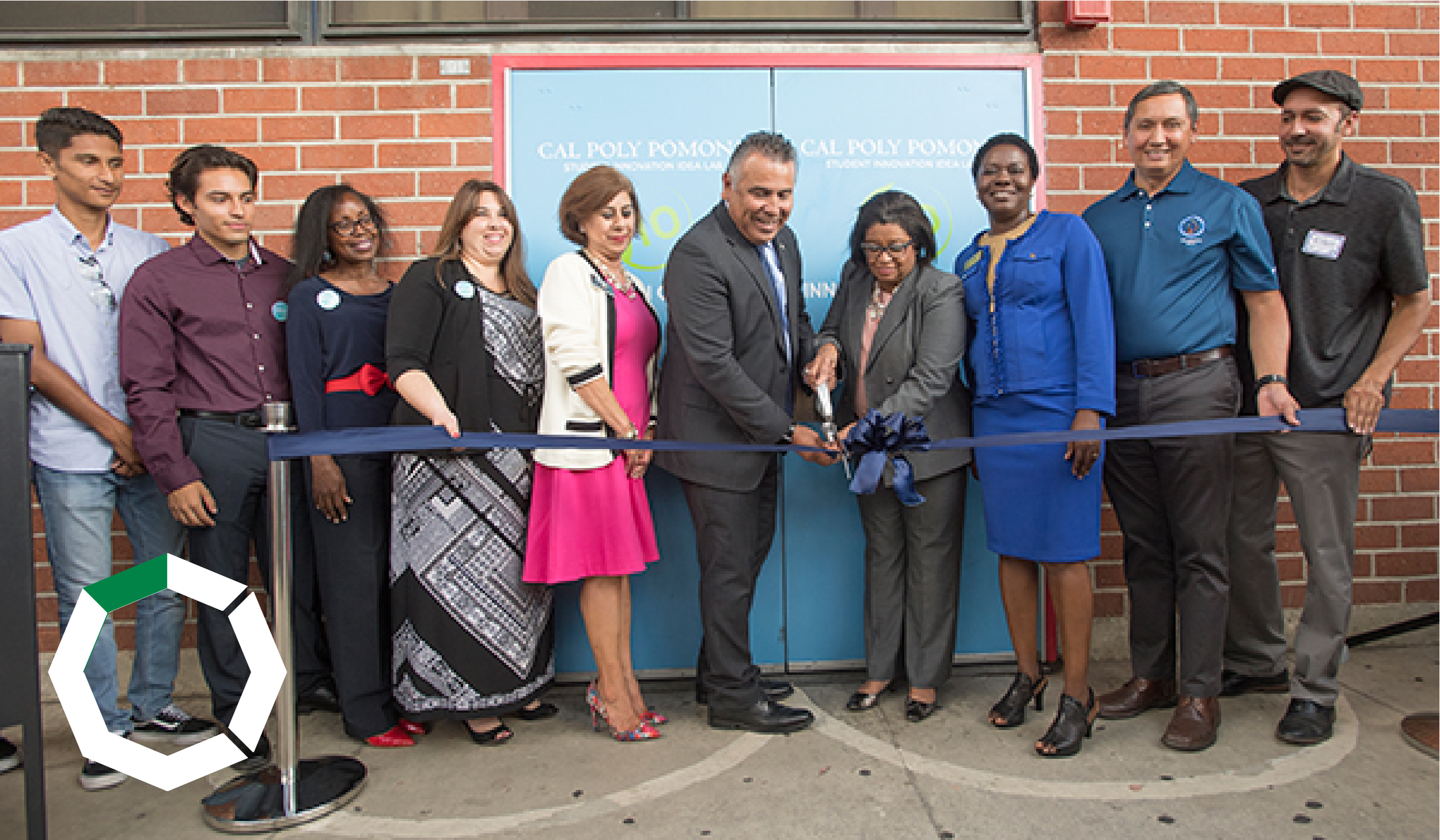 President Coley cuts a ribbon