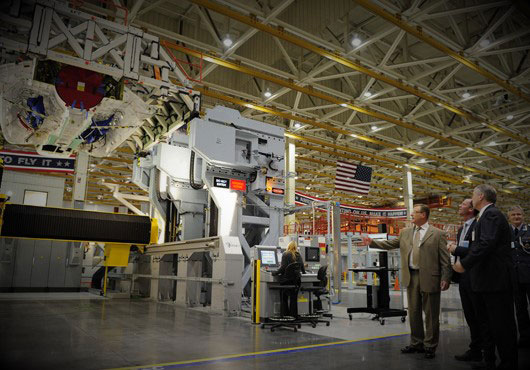 Business men in suits in a warehouse