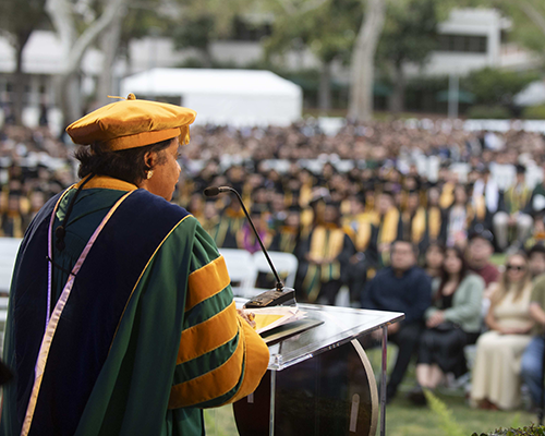 President Coley speaks to graduates during a commencement ceremony