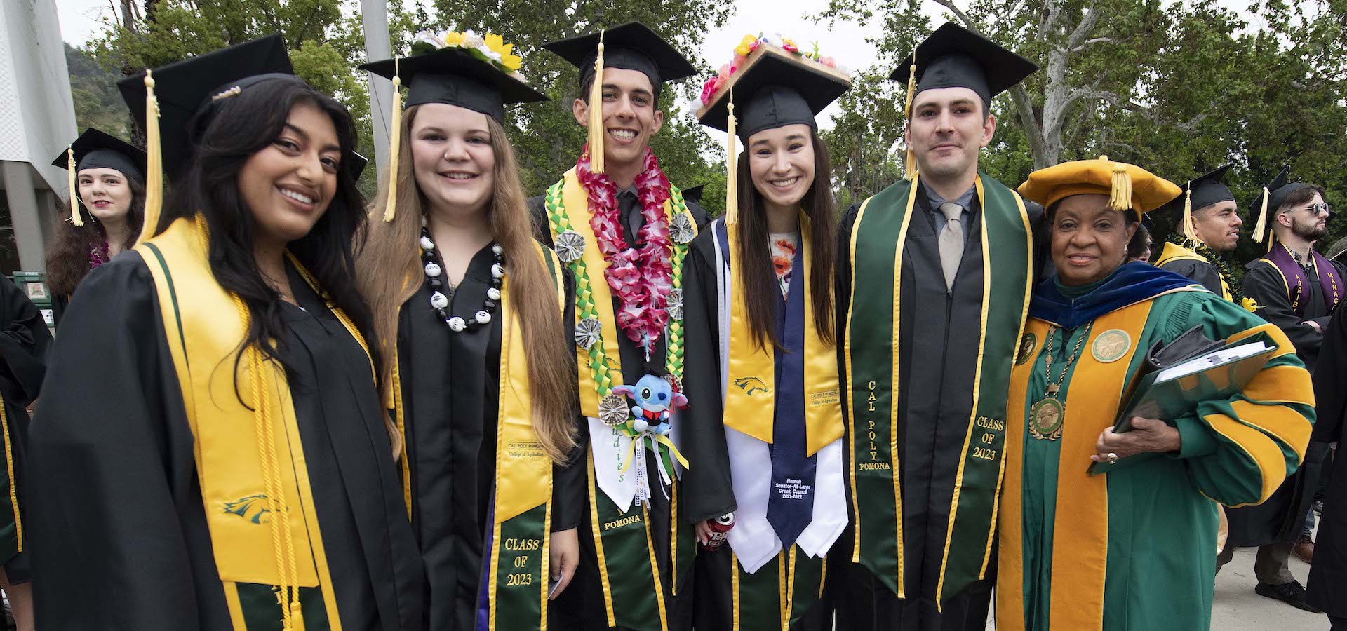 President Coley visits with students before commencement ceremonies. 