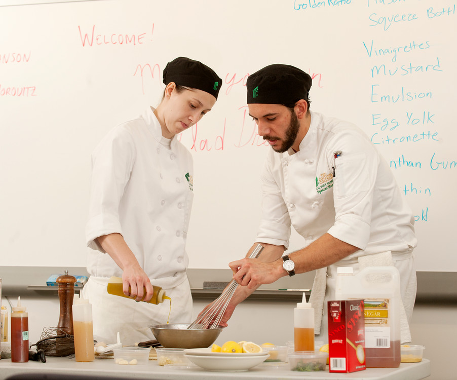 students cooking a dish