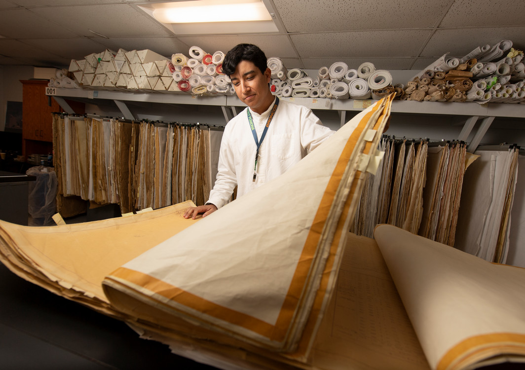 student examining fabrics