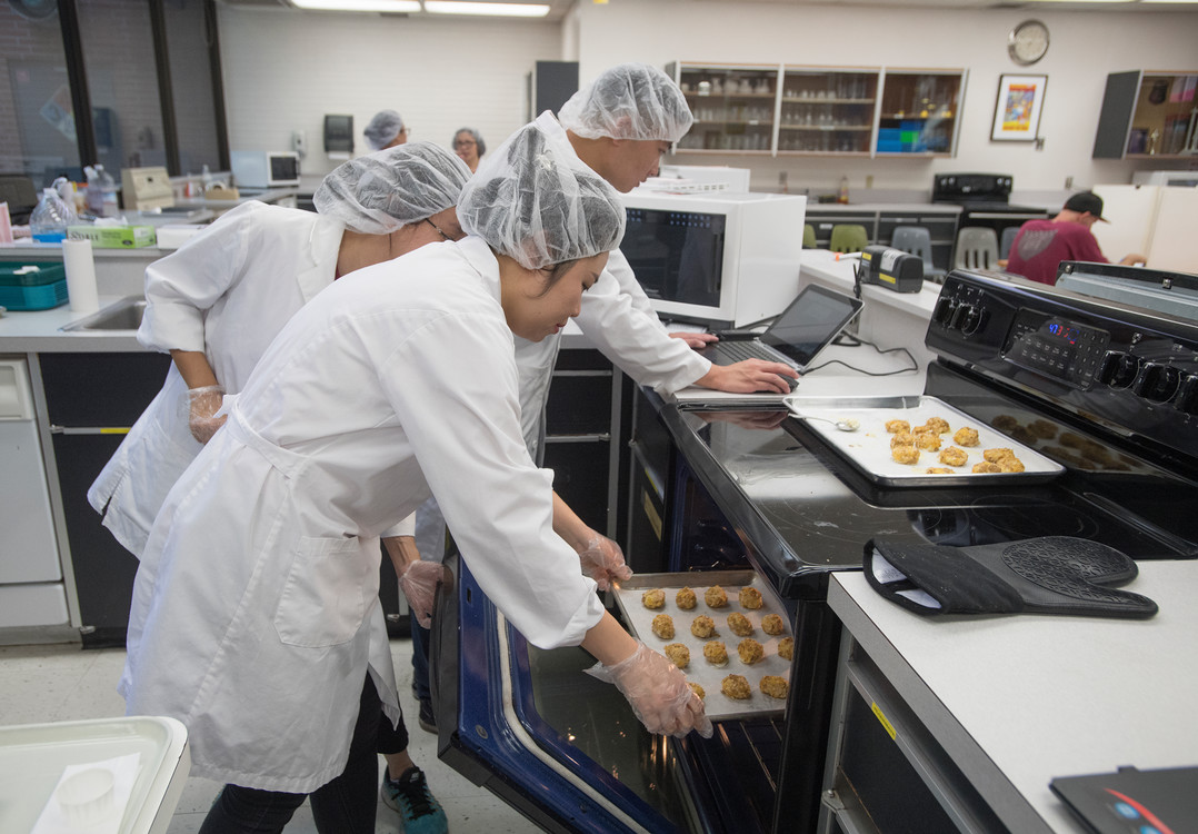 students cooking food for testing