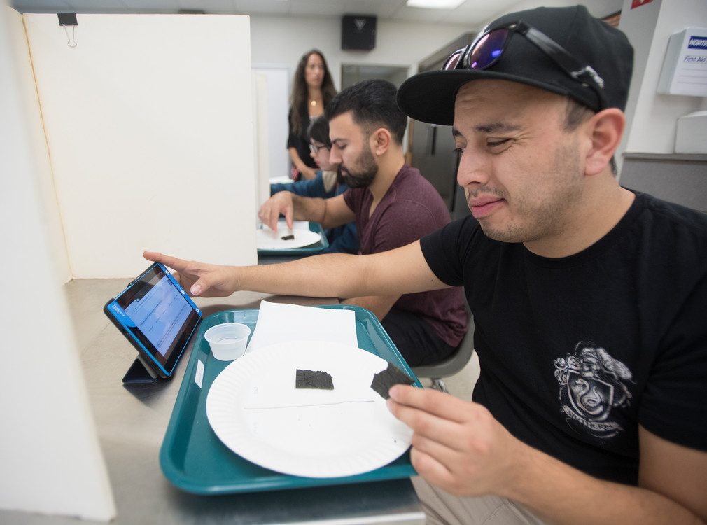 student taste testing food