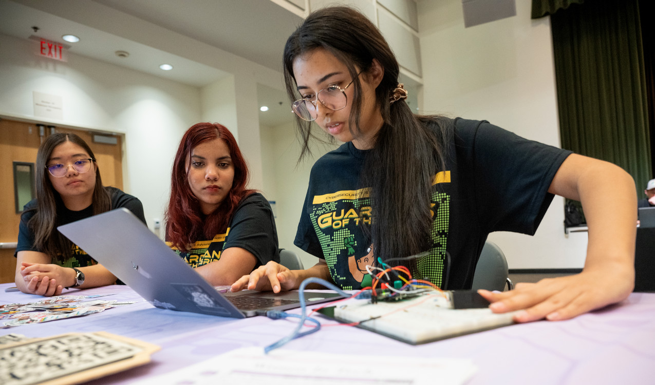 student works on cybersecurity project